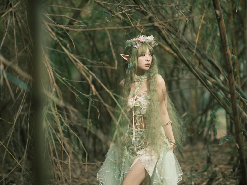 Fantasy-themed portrait of an elf in a bamboo forest, evoking a magical and ethereal atmosphere.